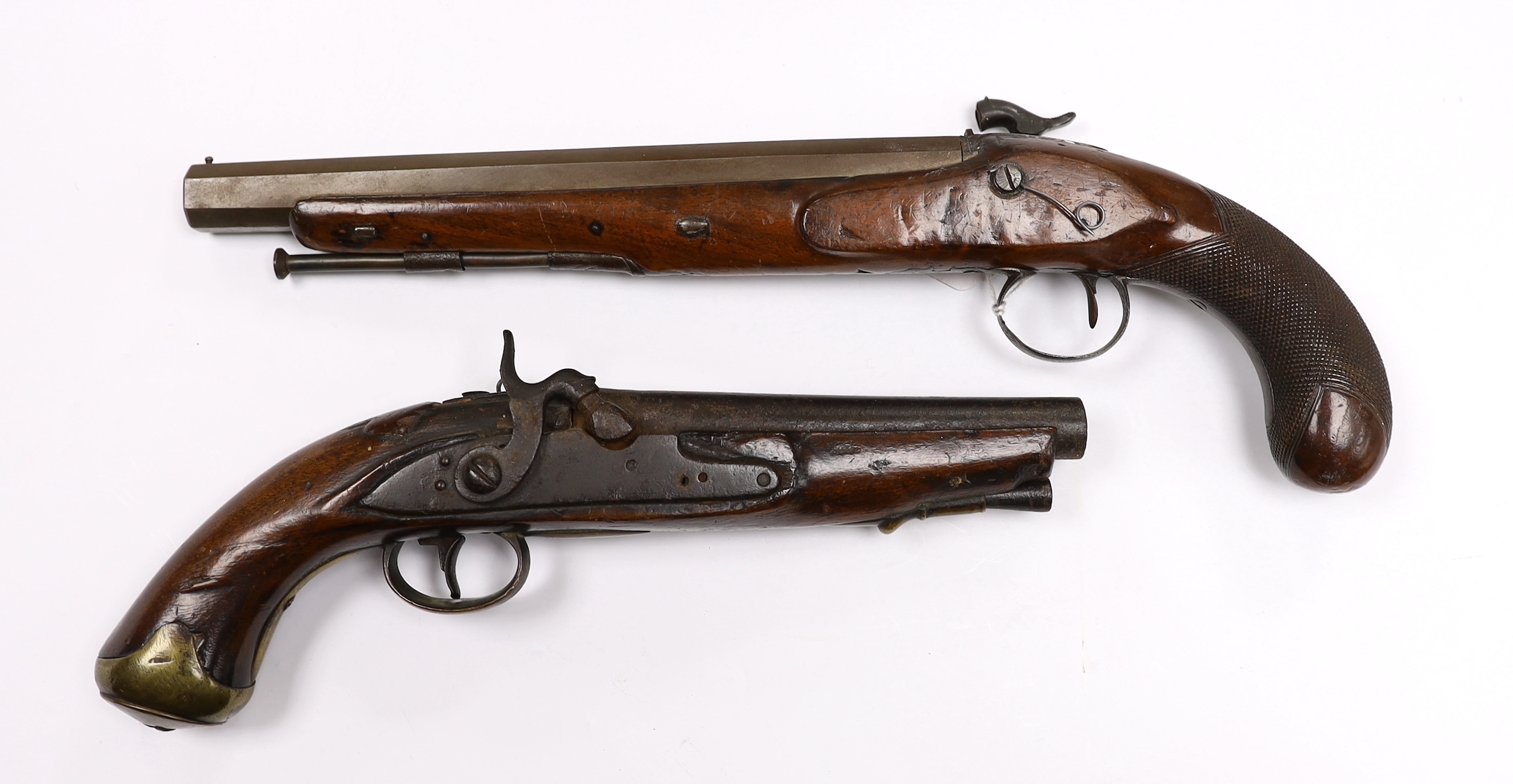 Two percussion 19th century pistols, both converted from flintlock, the larger example with engraved lock and hammer, octagonal barrel and chequered grip, together with a smaller overcoat pistol, fully stocked with brass